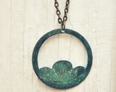 verdigris lotus necklace.