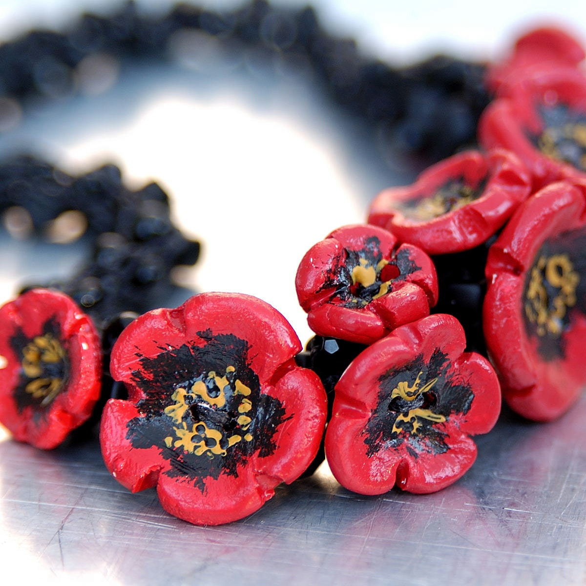 Clay Poppies Yarn Necklace - Hand-knitted from Black Nylon Yarn with Black Glass Beads and a Bouquet of Clay Poppies