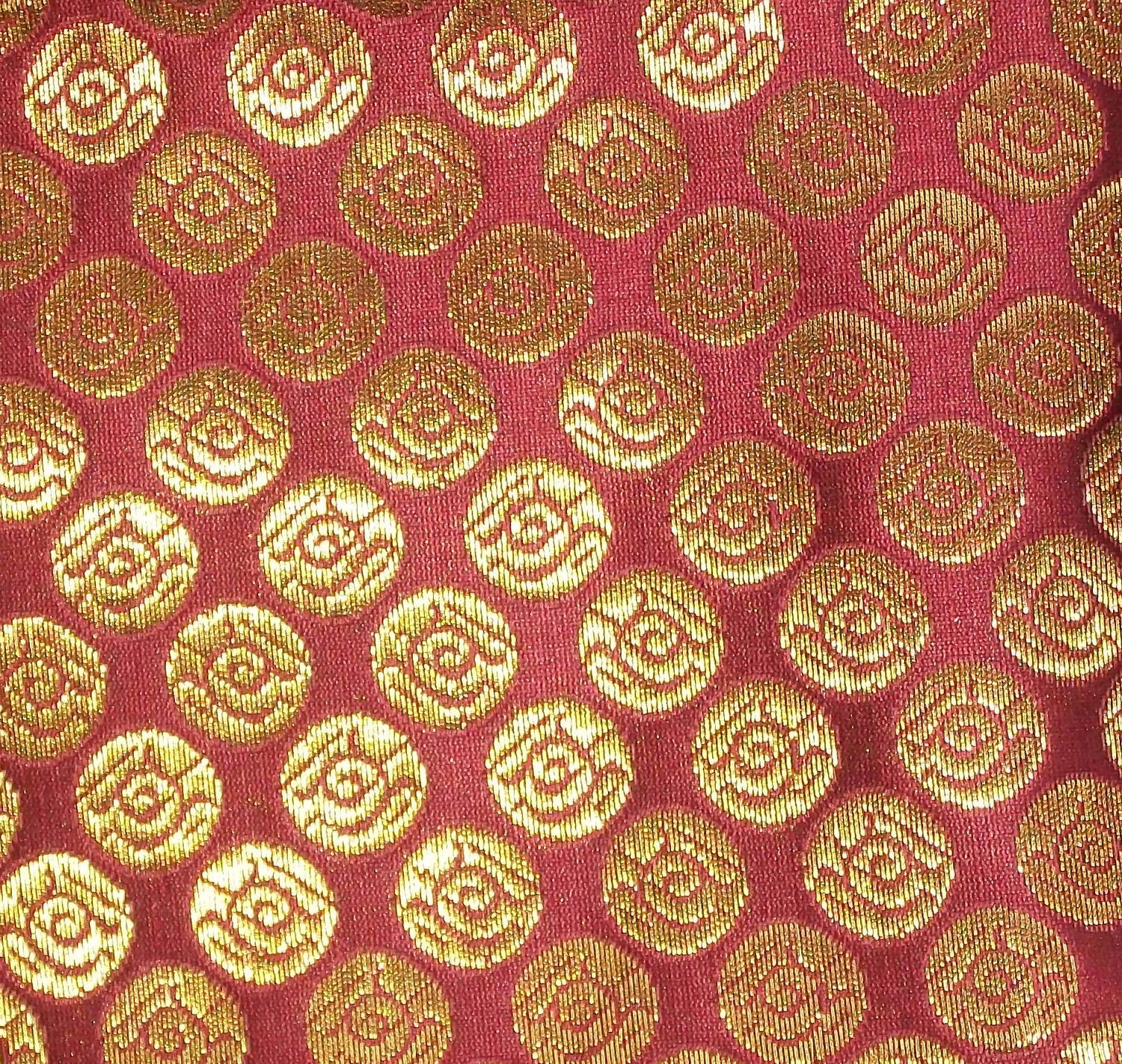 Fat quarter brick red Indian silk brocade fabric in a circle pattern