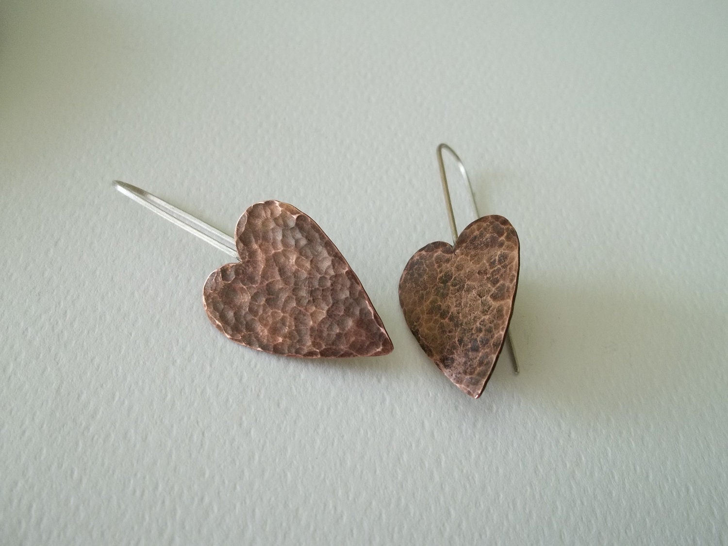 Handmade  hammered oxidized copper hearts earrings ,sterling silver wire.