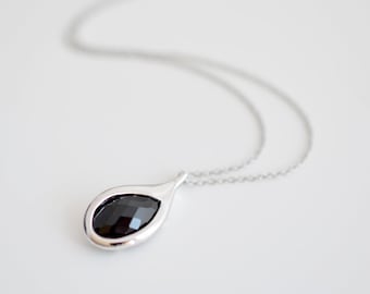 Simple black glass framed pendant necklace.