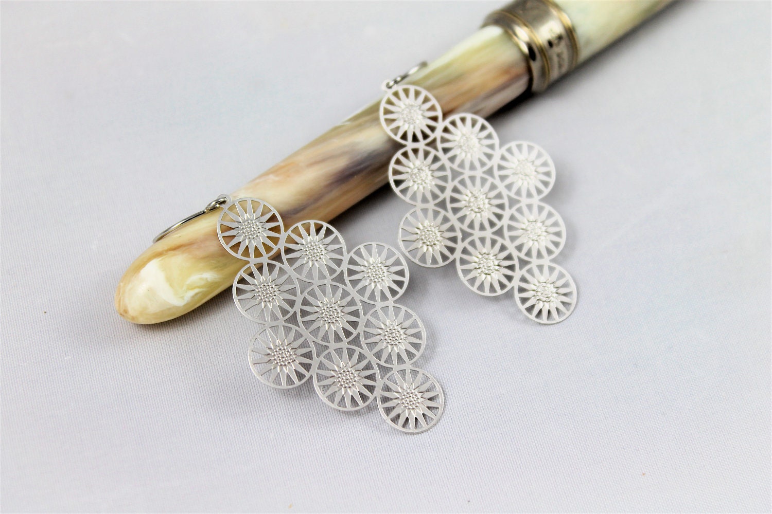 Matte silver earrings multiple star circles light weight modern high fashion simple 60's look