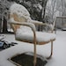 Old Metal Chair in the Snow is an 8"x10" framed photograph.