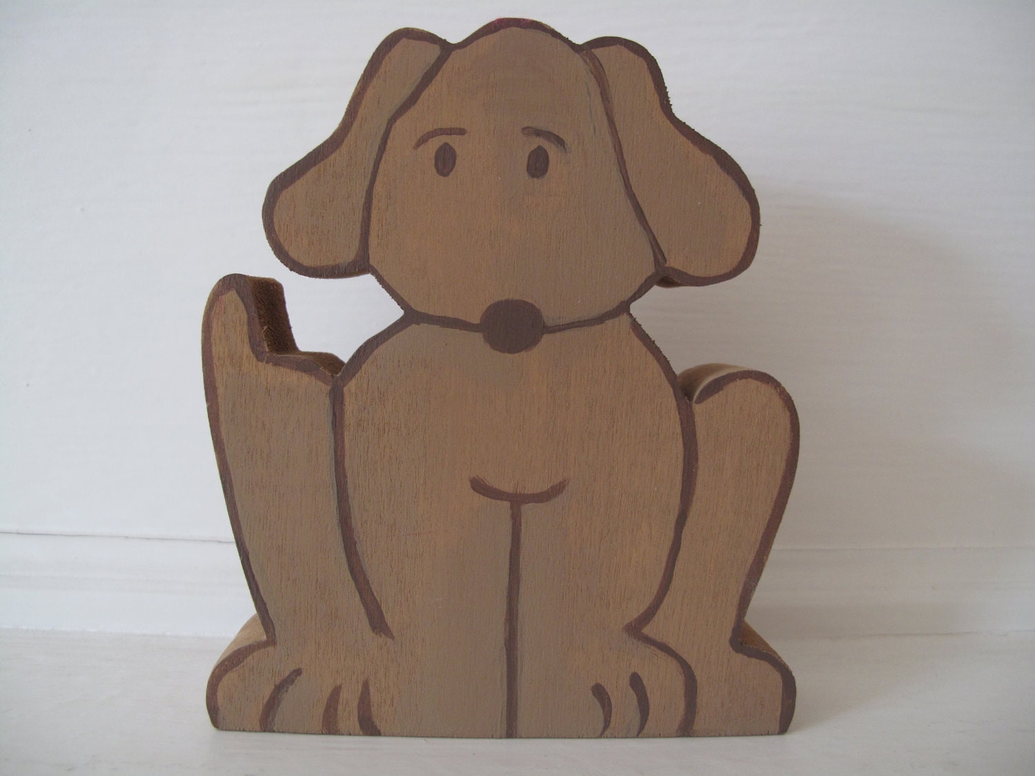 Small sitting dog wood carving