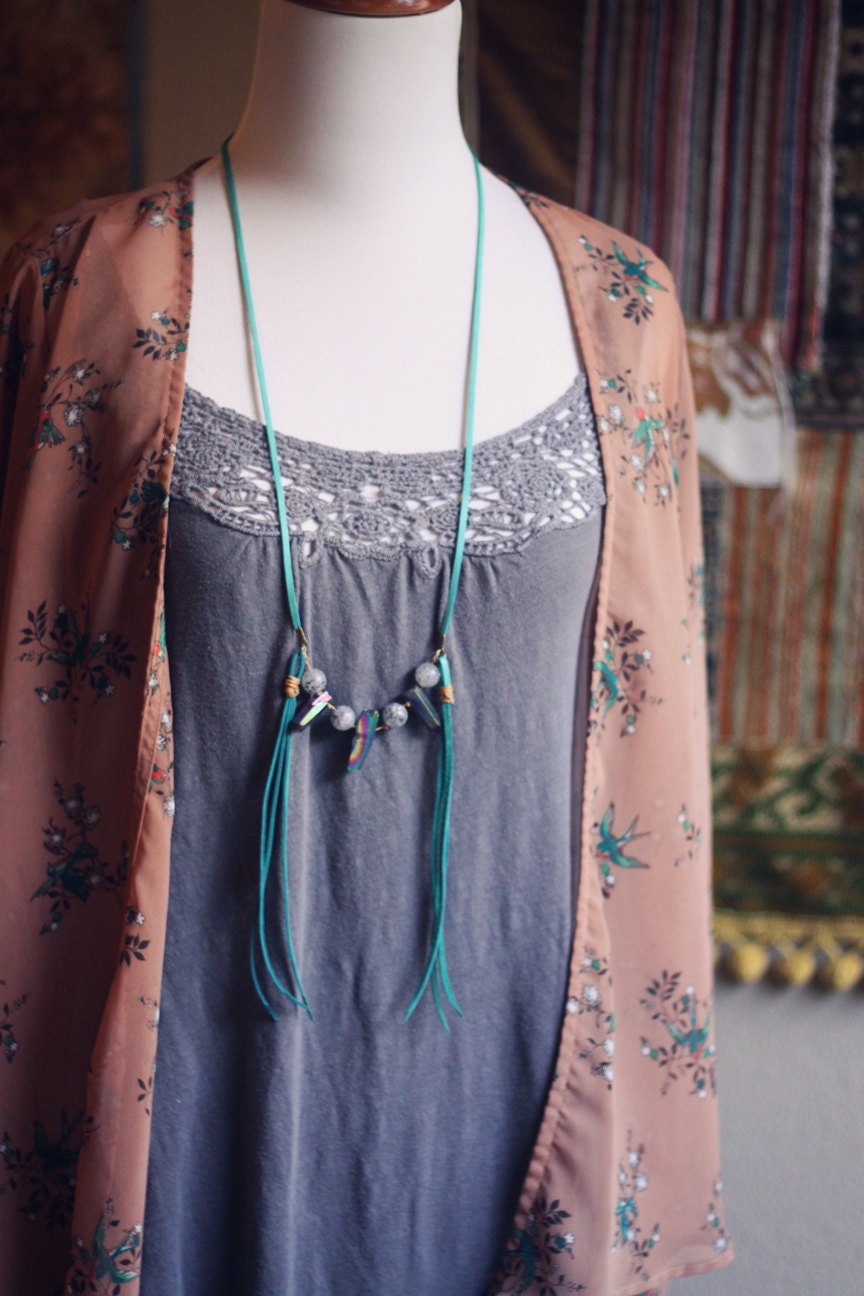 olli.  a mystic rainbow quartz and teal deerskin necklace.