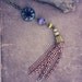 takala. a long beaded copper tassel necklace.