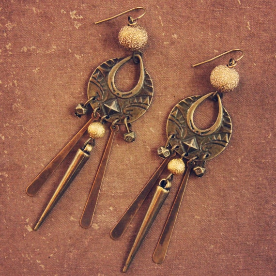 nevada. a pair of gold and brass tribal earrings with a hint of sparkle.