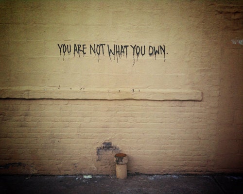 You Are Not What You Own graffiti message on Gowanus Brooklyn wall