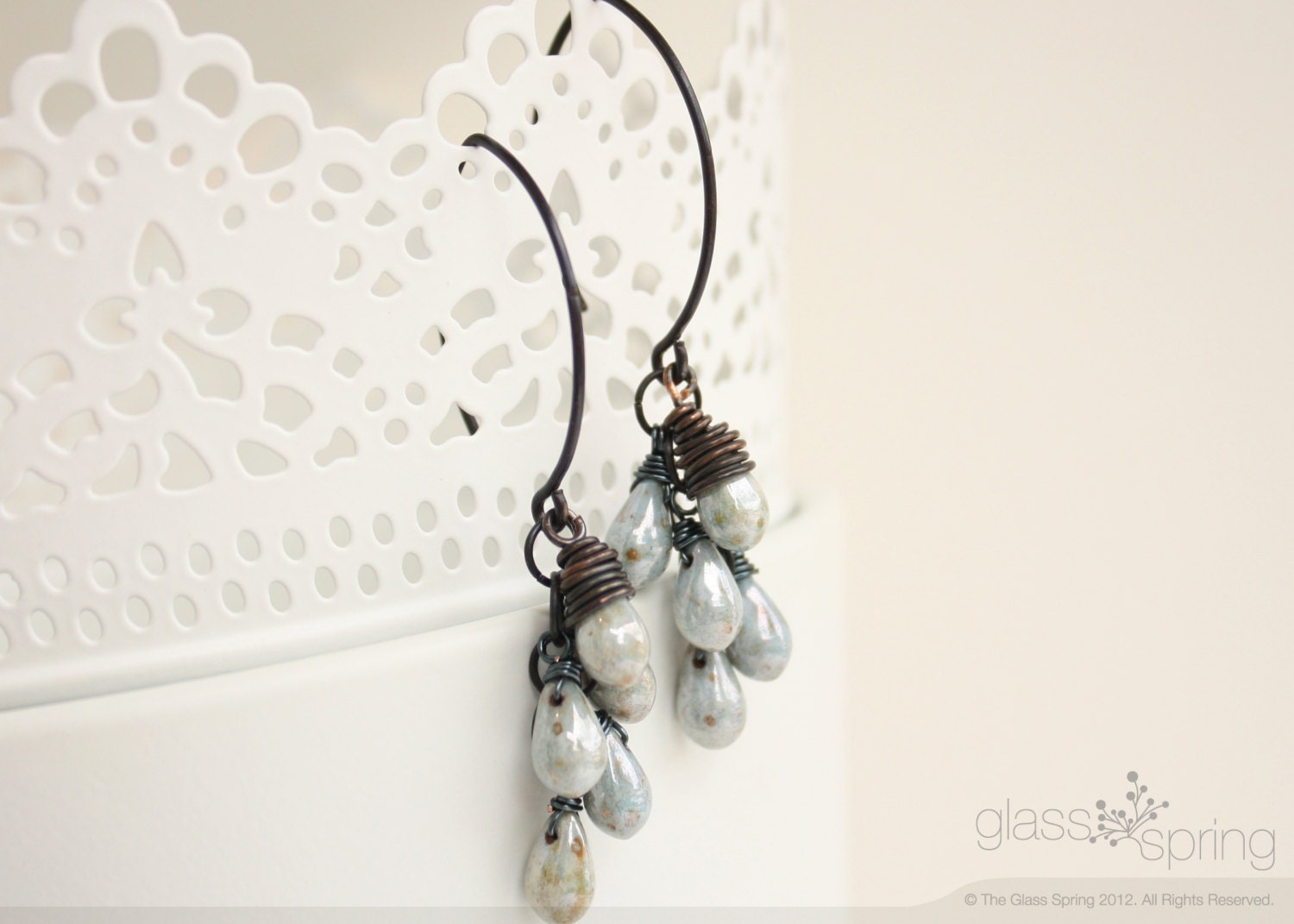 Earrings wire wrapped with antique brass wire with blue czech glass picasso drop beads.