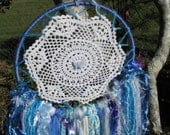 Dreamcatcher Wall Hanging - Butterfly Blue - made with novelty yarn in various shades of blue and white with a touch of pink