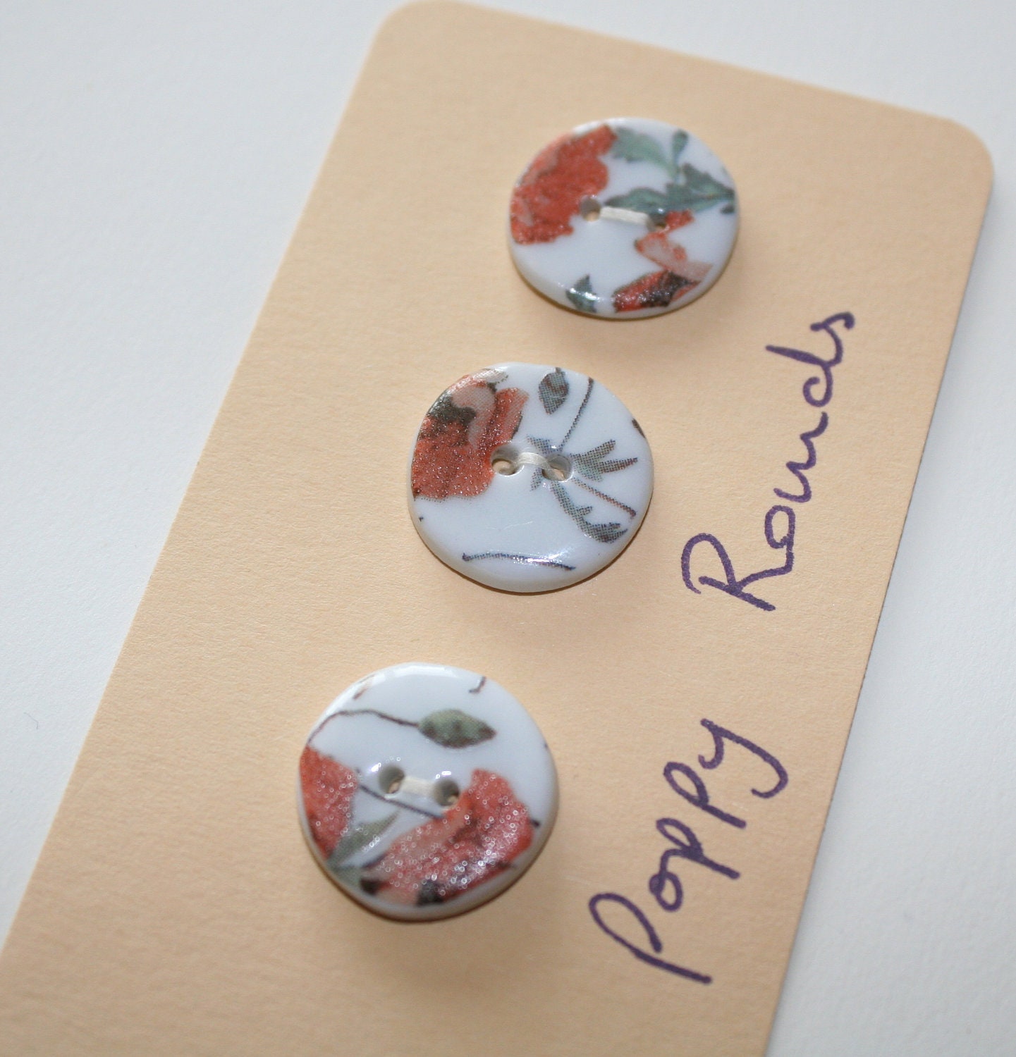 Ceramic buttons, small round with red poppy flower design, very shabby or cottage chic