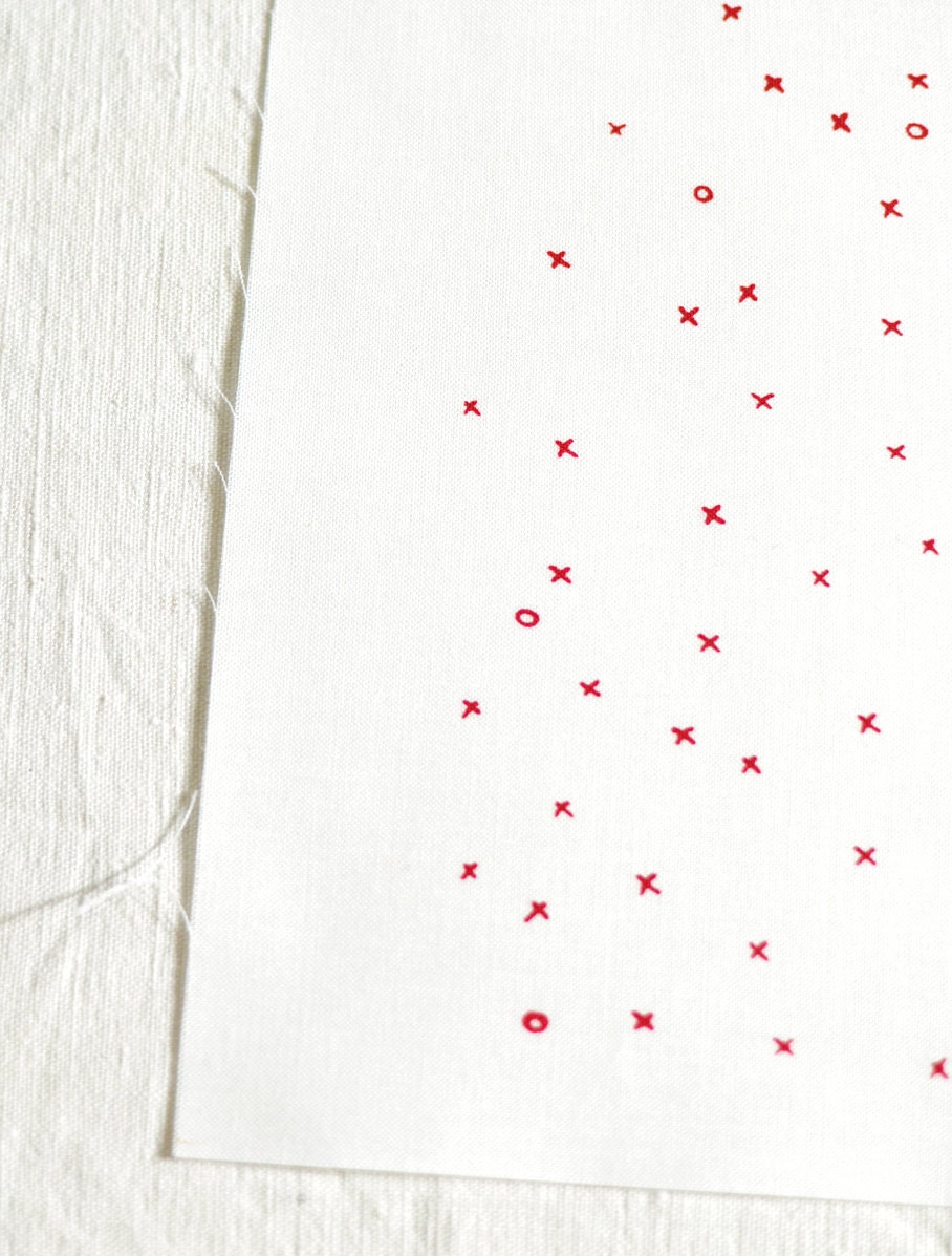 xox in perfect red on pure white handprinted fabric panel