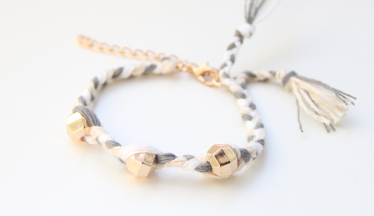 ON SALE: Arm candy - Golden beads on White grey braid - woven bracelet