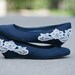 Navy blue ballet flat/low wedge wedding shoes with ivory lace applique. US Size 8