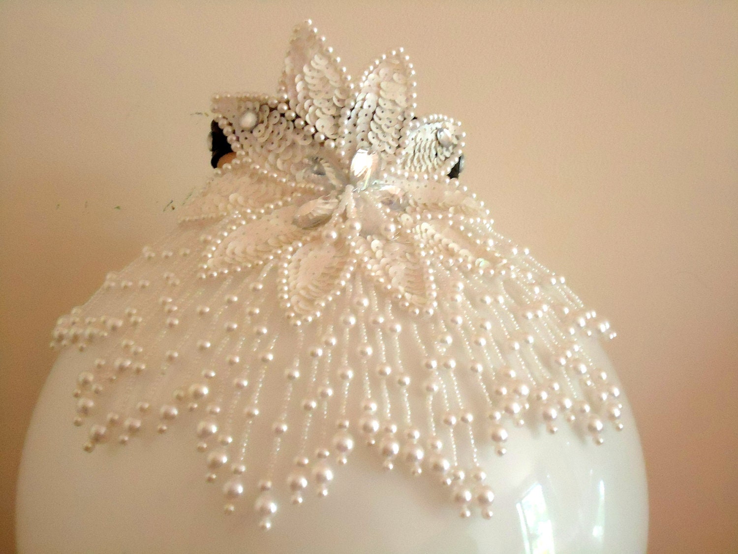 Dog collar for your pooch at a wedding or party.Sequin petal star flower with seeded and pearl cascading drop. 10 to 11 inch. Black leather