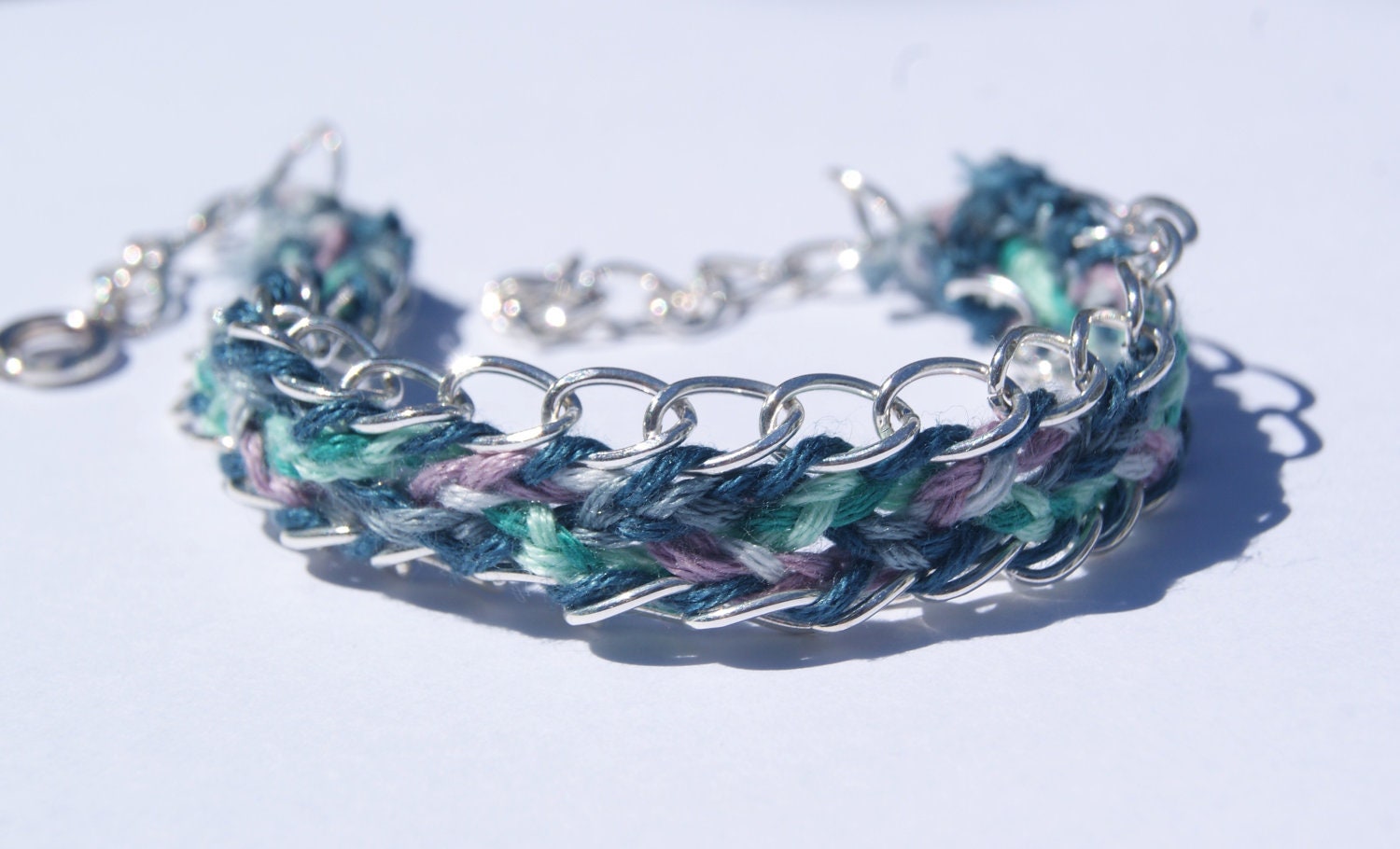 Plaited friendship bracelet with chains