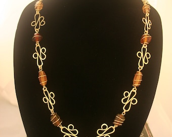 Brass Wire wrapped Hammered Necklace With Brown & Amber Colored beads.