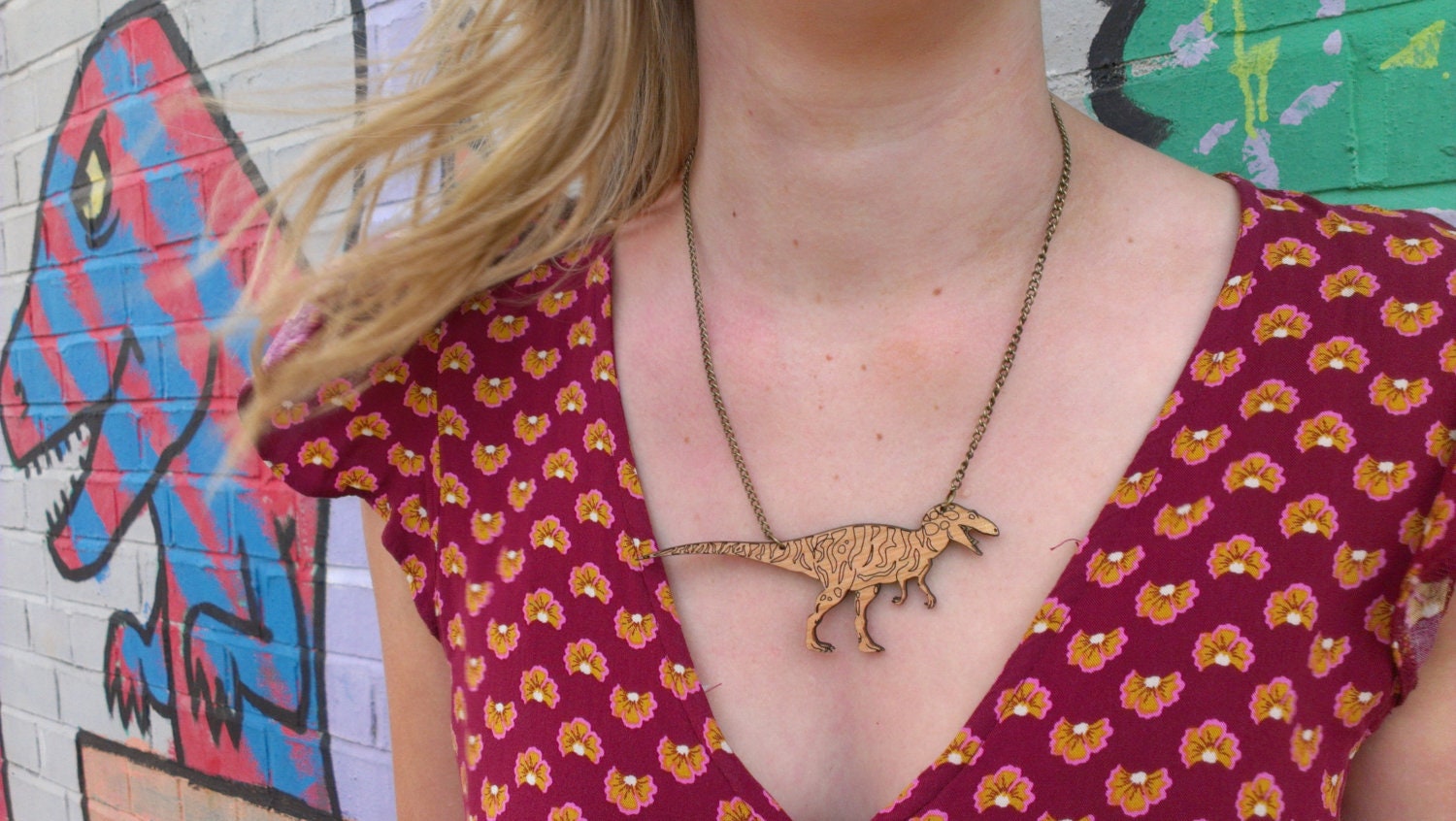 Allosaurus Necklace. Laser Cut Acrylic Dinosaur Necklace. Mirrored Perspex and Cherry Wood.