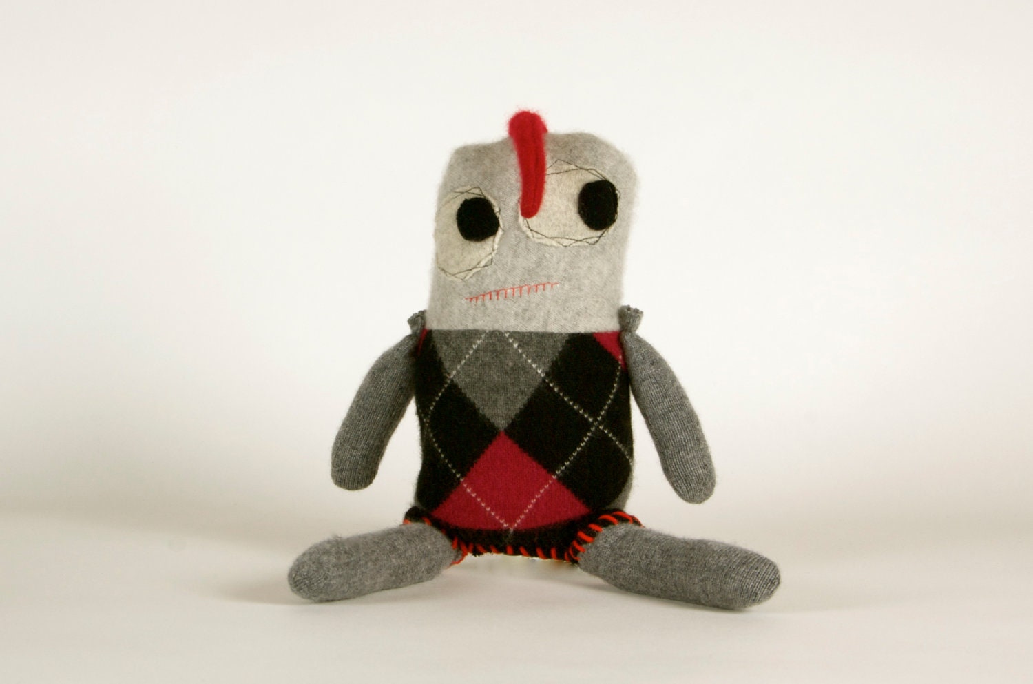 Snuggly munchkins, handmade Argyle cashmere monsters in black,red & grey