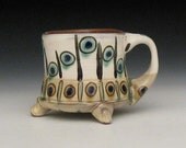 peacock design mug with feet