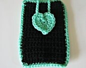 Crocheted phone cover in black with a mint green heart and trim