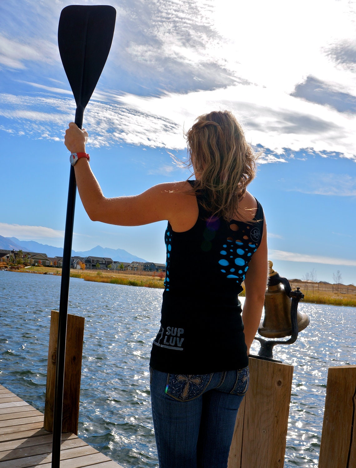 SUP LUV done in vintage looking silk screen on a workout black tank top with a random hole front and back