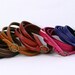 Thin leather bracelet. Wear as skinny belt or wrap bracelet or watch strap. Genuine leather with bronze metal buckle. Ships from US. B002