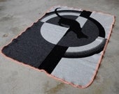 Knitted merino wool blanket for children.  Art deco inspired cat motif.