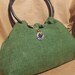 Forest Green Handbag with Black Bamboo Handles and Floral Spiral Charm