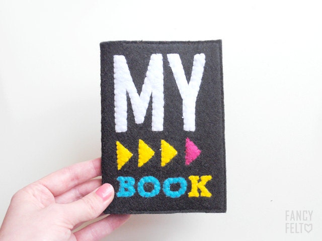 Black felt passport case with inscription