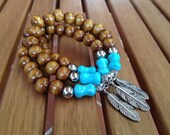 Tribal Wood and Turquoise Howlite Bracelet with Tibetan Silver Feather Charm. Handmade bracelet