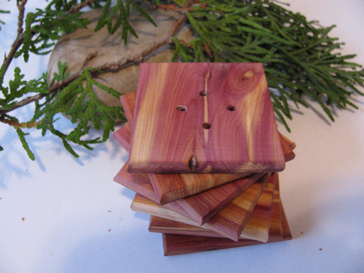 Seven wood buttons Made of juniper wood. 2" x 2" x 1/4 thick