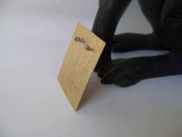 Copper brooch made from copper and brass sheet metal that was heat treated.