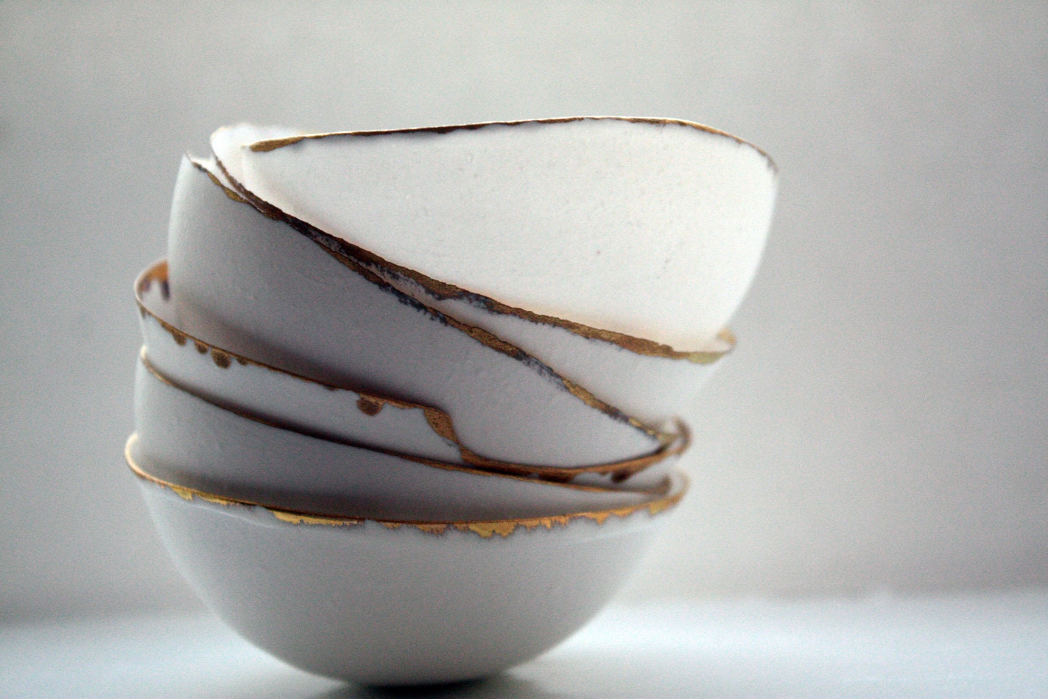 Fine bone china small stoneware bowl with matt real gold.