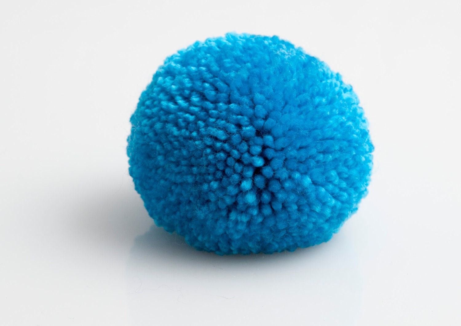 handmade brooch with a big dark blue pompom, pom pom, pompon by bimabejbe