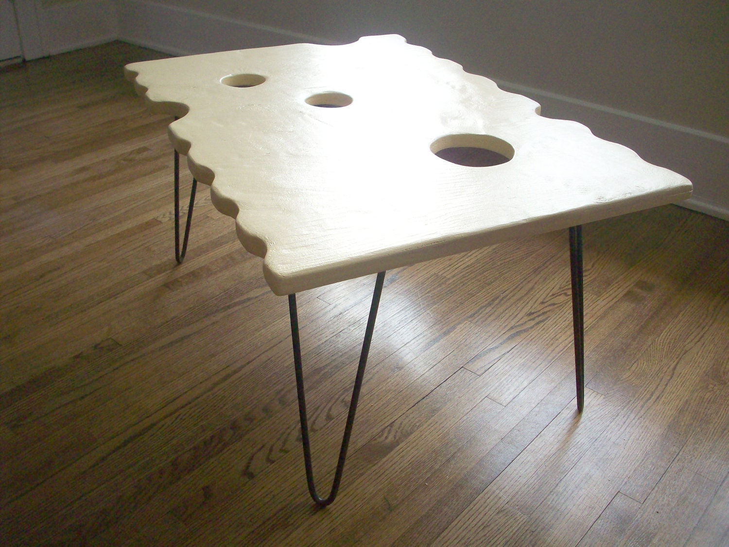 Swiss Cheese Cracker Coffee Table on Hairpin Legs. unique one of a kind modern furniture.
