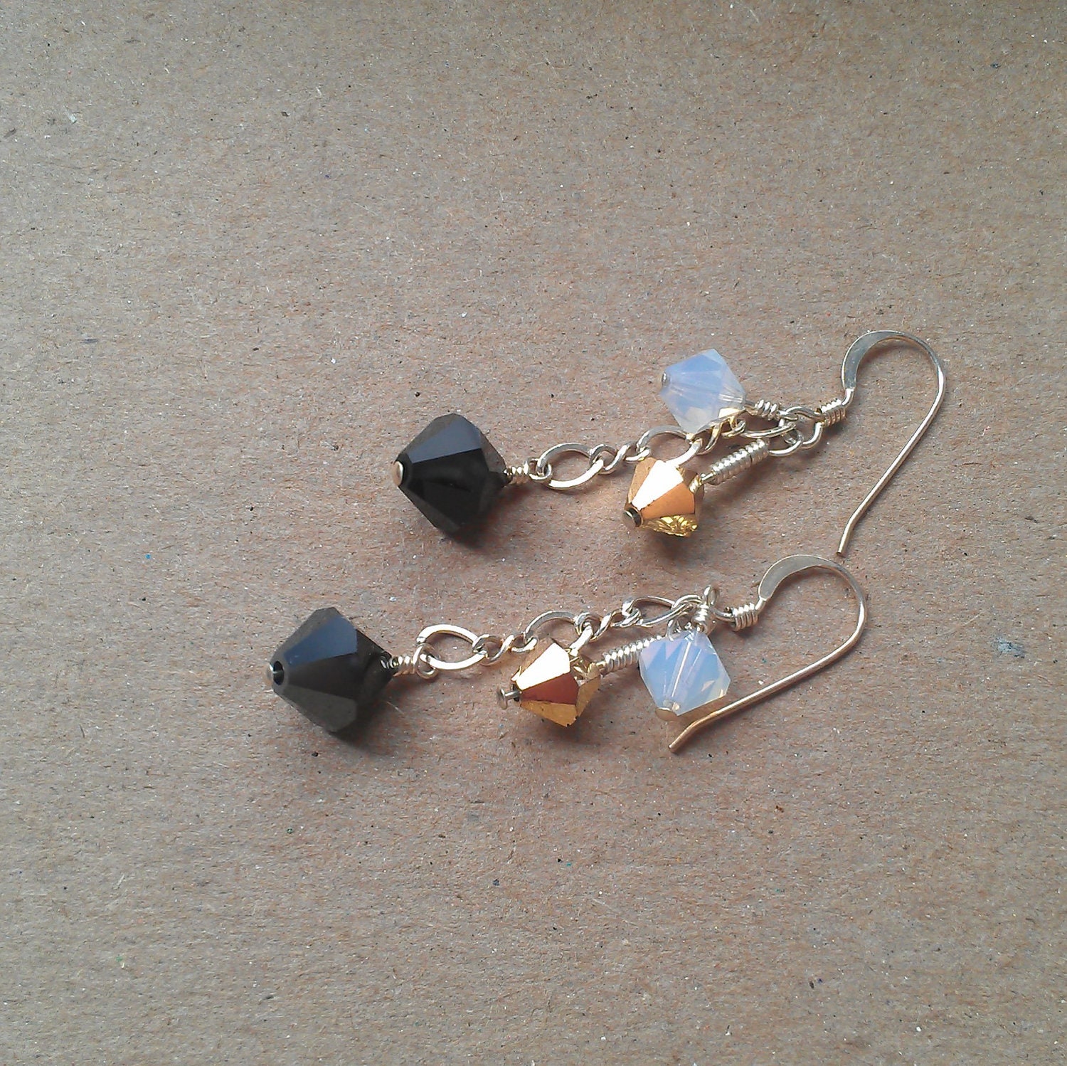 charming gold opaque and black swarovski crystal earrings