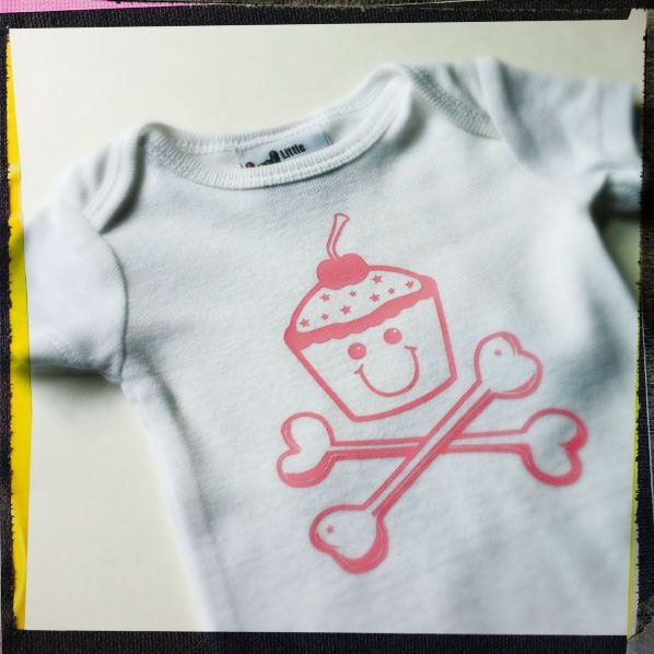 Cupcakes & Crossbones Newborn Size -- adorable for punk rock / heavy metal baby girl clothes White onesie. Black or Pink Image.