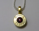 Bullet Necklace . 38 Special Brass Bullet . January Garnet