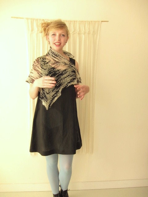 A beautifully mix of black ,cream and light grey colored knit shawl