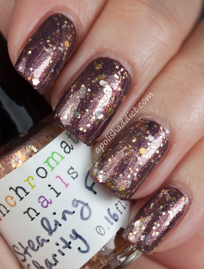 Stealing From Charity Nail Polish - color-shifting glitter topcoat