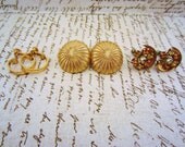One pair of clip on earrings. Hoop, citrine and topaz rhinestone or large gold stud. Clip on, screw back, unpierced ears. Gold earrings.