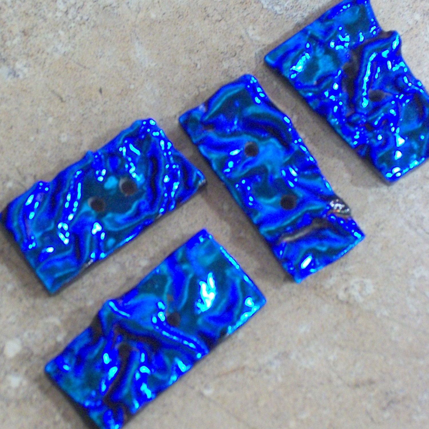 set of four rectangular freeform dichroic glass buttons