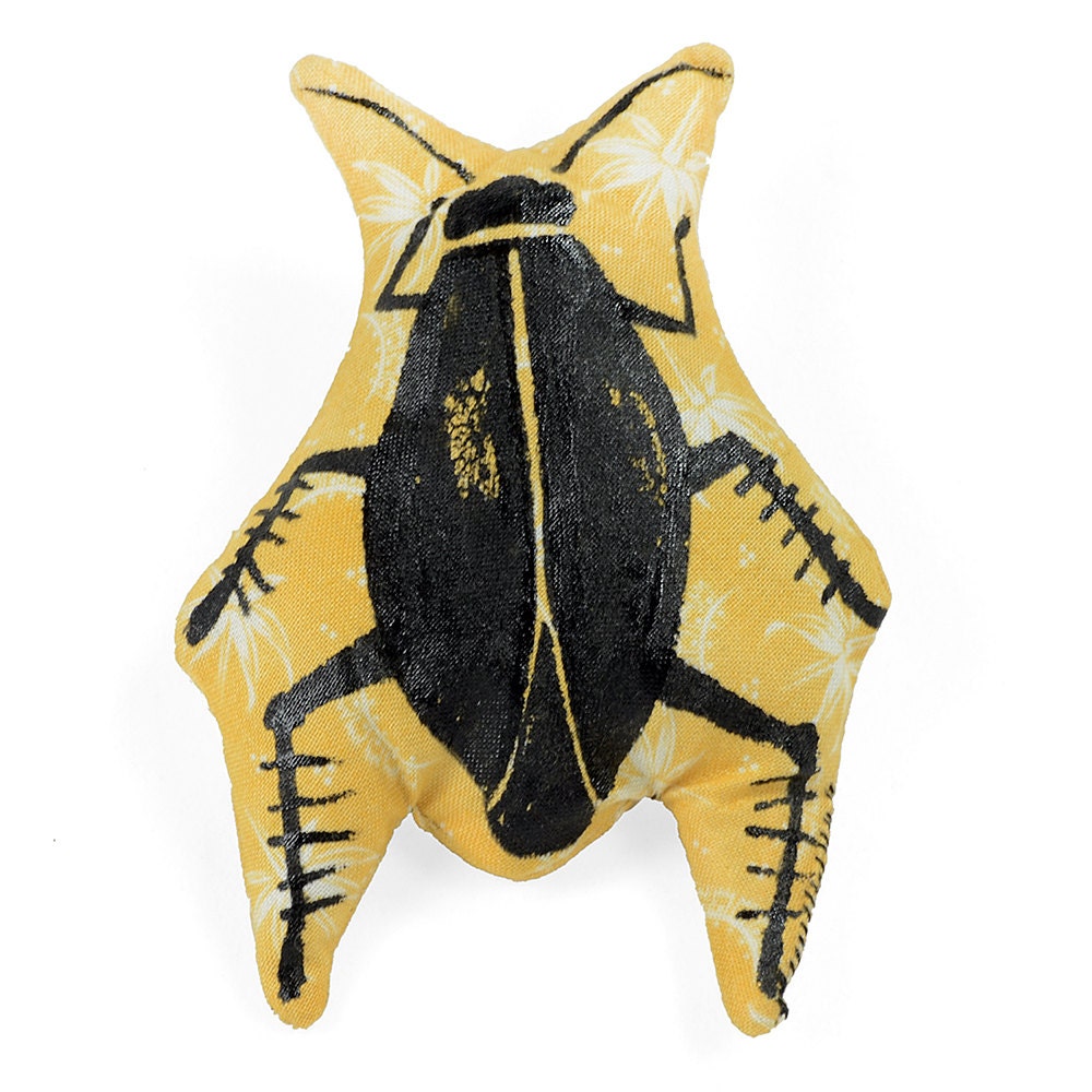 catnip cockroach drawn on yellow & white fabric