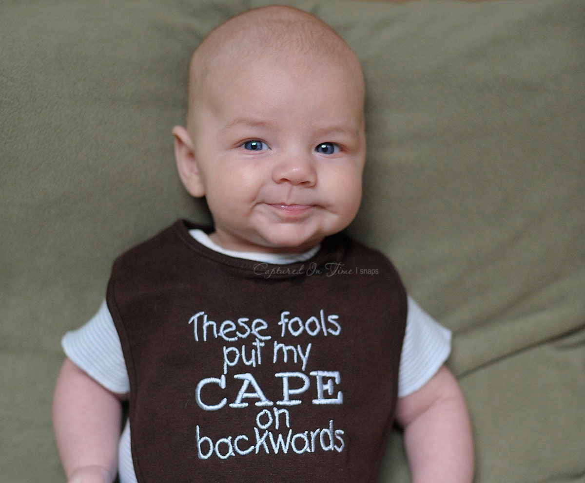 These Fools Put My Cape on Backwards Bib Brown Blue