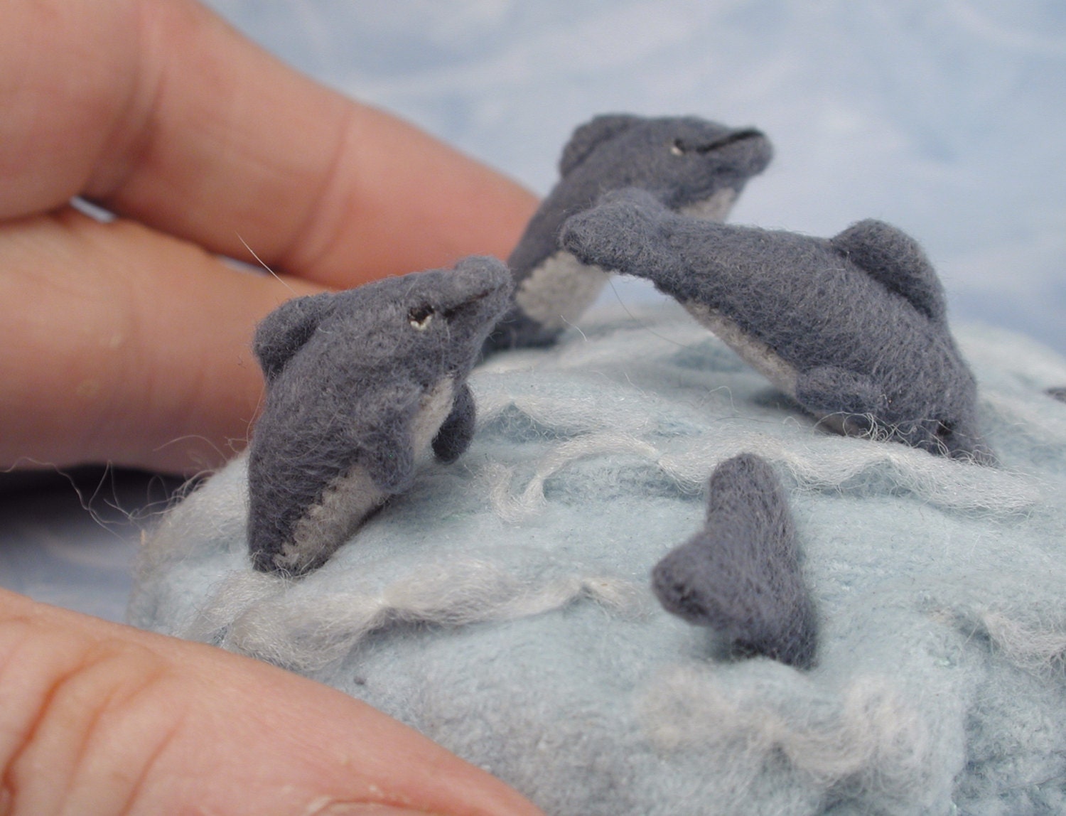 Tiny Dolphins on a Fabric Sea