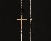 14KT Gold Kelly Cross with A Tiny Bezel Diamond