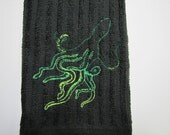 Variegated Green Octopus on Black Towel
