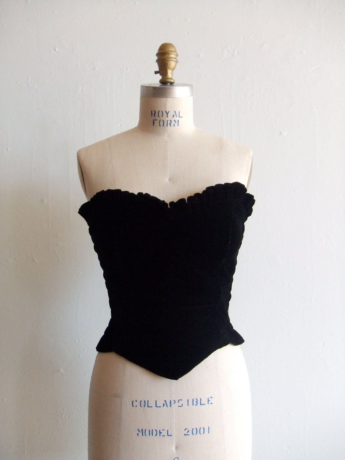 Vintage 1980s black velvet bustier with ruffled bodice and basque waistline