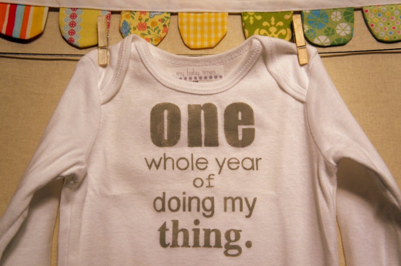 one whole year of doing my thing --- white long sleeved onesie, size 12 months